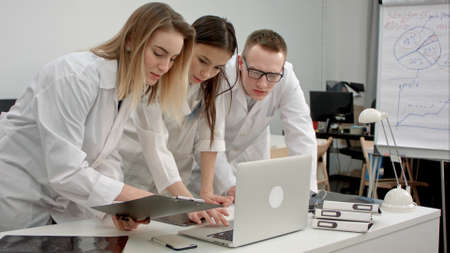 Medical doctors team using laptop in the officeの写真素材
