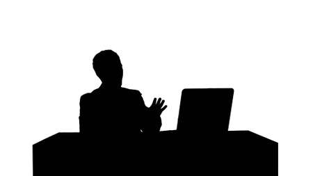 Silhouette Happy and smile man webcamming with friend on laptopの写真素材