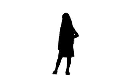 Silhouette Adorable little girl smiling at camera and posing track matteの写真素材