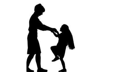 Silhouette Mother and daughter dancing together track matteの写真素材