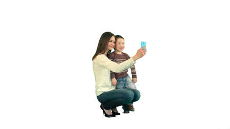 Mother And Son Posing For Selfie  on white background isolatedの写真素材