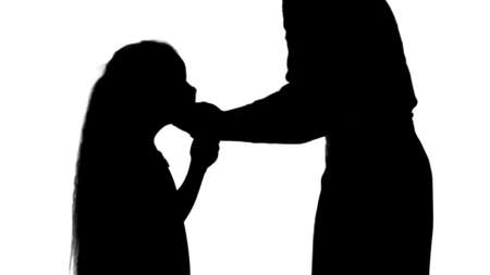 Silhouette Mother and daughter wearing surgical masks to protect from an epidemic track matteの写真素材