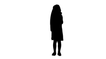 Silhouette Kid girl eating ice cream track matteの写真素材