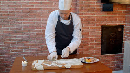 Chef cutting dough into circlesの写真素材