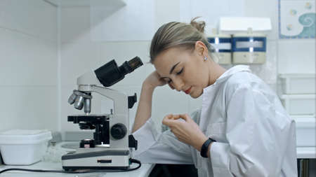 Female medical doctor bored at workの写真素材
