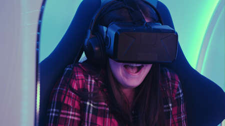 Young girl looking via virtual reality device and feeling scary