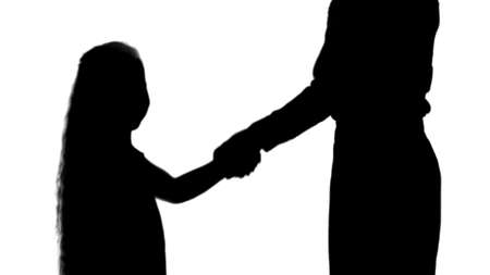 Silhouette Daughter and mother hand shake track matteの写真素材