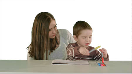 Happy family mother and child painting together on white background isolatedの写真素材
