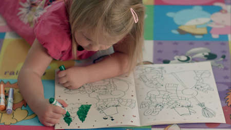 The thoughtful girl with a felt-tip pen