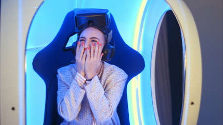 Amazed young woman left speechless after virtual reality sessionの写真素材