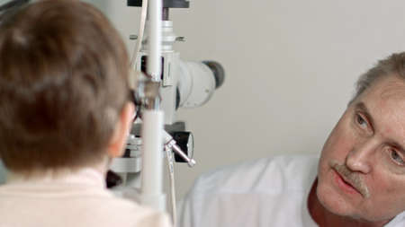 Young boy patient is having a medical attendance at the optometrist