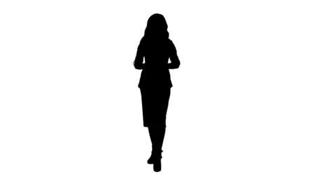 Silhouette Young attractive asian woman talks to camera, presenting something track matteの写真素材