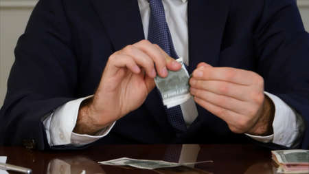 Businessman hands tears moneyの写真素材
