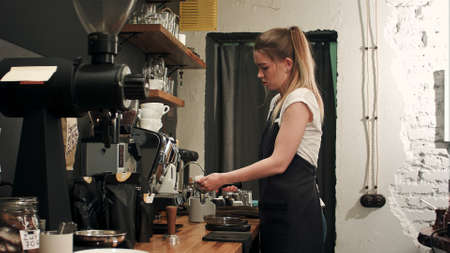 Barista making coffee with proffessional brewing coffee barの写真素材
