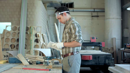 Two carpenters works in workshop.Timelapsの写真素材