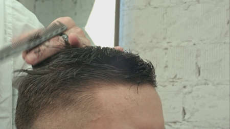 Mens haircut at the barber scissorsの写真素材