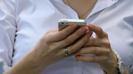 Woman using smart phone mobileの写真素材