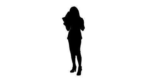 Silhouette Young business woman holding documents, reading papers track matteの写真素材