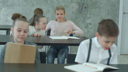 Group of students in class during breakの写真素材