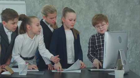 Business children spend a meeting, arguing in the officeの写真素材