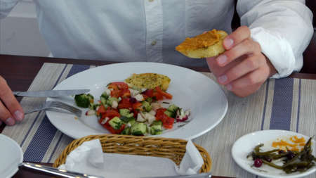 Young woman and man eating healthy and delicious saladの写真素材