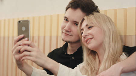Couple taking selfie at breakfast timeの写真素材