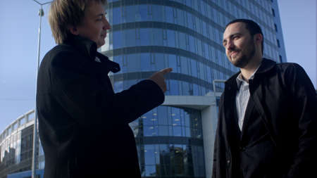Two business professionals having a meeting outsideの写真素材