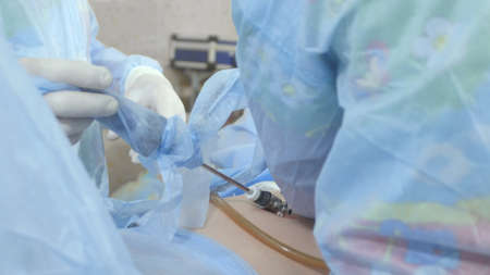 Surgeons follow the laparoscopic surgeryの写真素材