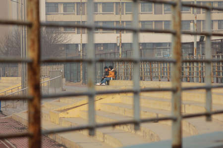 Campus couple on winter playgroundのeditorial素材