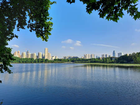 Landscape view of the lake and the city skyline in China.の写真素材