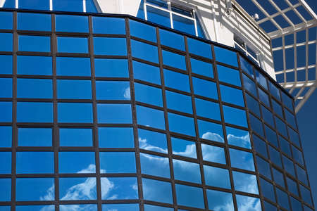 office building with reflected by sky,Hi-tech  architectureの写真素材