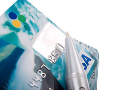 Close-up a pen over credit card. Only partial numbers are visibleの写真素材