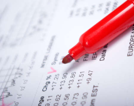 red marker and business documents - closeupの写真素材