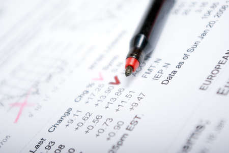 red marker and business diagram- close up ,numeric factors incomの写真素材