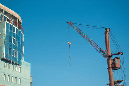 Lifting crane on building of the new house.The Building technologyの写真素材