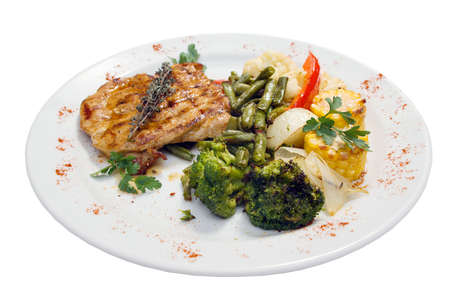 Grilled steak with french fries and broccoli on a white plateの写真素材