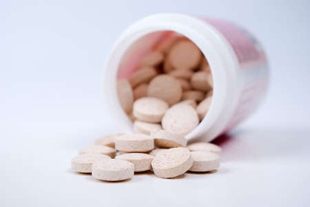 Tablets  ,Pills Spilling out of Pill Bottle closeupの写真素材
