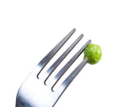 Green peas on fork..Vegetable dish