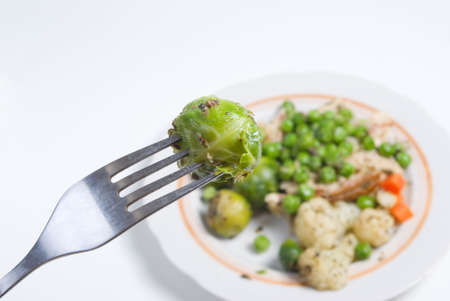 Brussels sprouts on fork.Vegetable dishの写真素材
