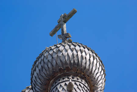 Dome on turn blue firmament.The Old-time wooden church. Ancient architectureの写真素材