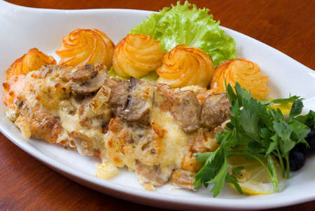 Italian kitchen.Veal with sauce and a potatoの写真素材