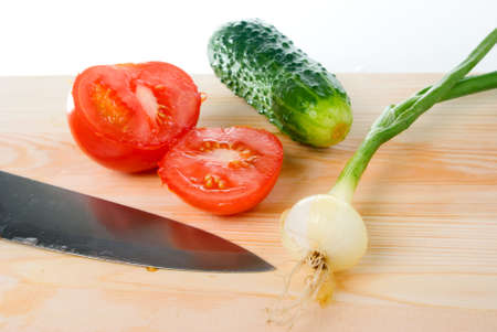 The Knife and fresh vegetables.Tomato,cucumber and onionの写真素材