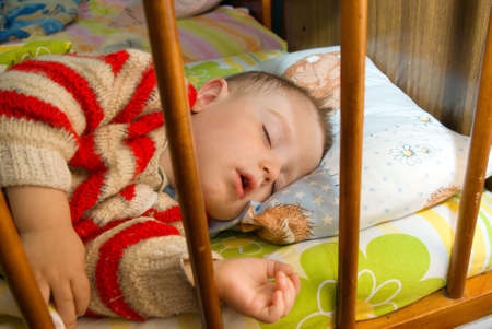 Sleeping tot,small boy,breast child,strong dreamの写真素材