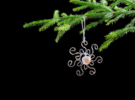 Christmas bauble  on background of the fur branchesの写真素材