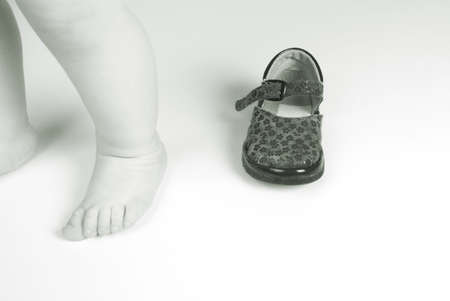 Children's leg and shoes.copyspace.monochromeの写真素材