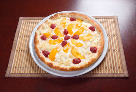 sweet pizza with fruit,Tasty Italian pizza  on plate.の写真素材
