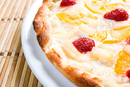 sweet pizza with fruit,Tasty Italian pizza  on plate  close upの写真素材