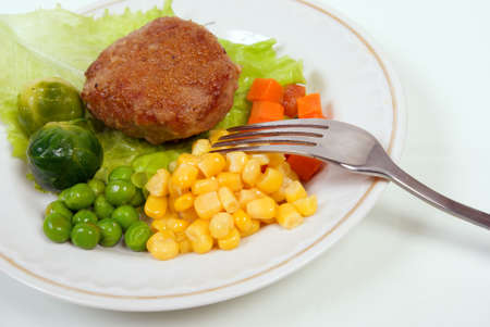 Pork chop with vegetables.green sheet of the saladの写真素材