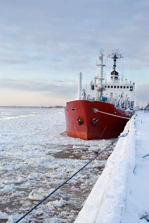 ship beside pier.Winter scene の写真素材