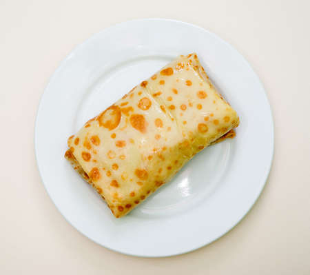 tasty home pancakes with meat on plateの写真素材